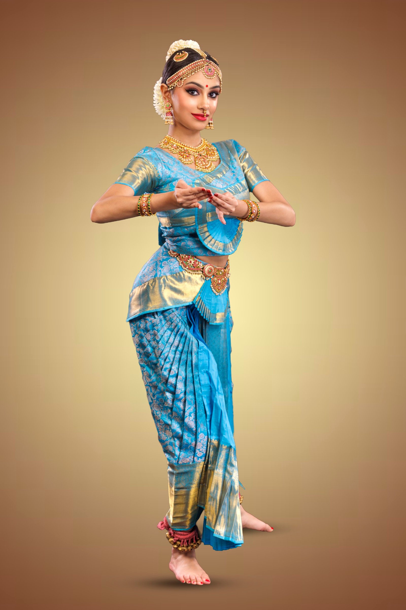 Ilesha standing with hands joined in a gesture at the chest