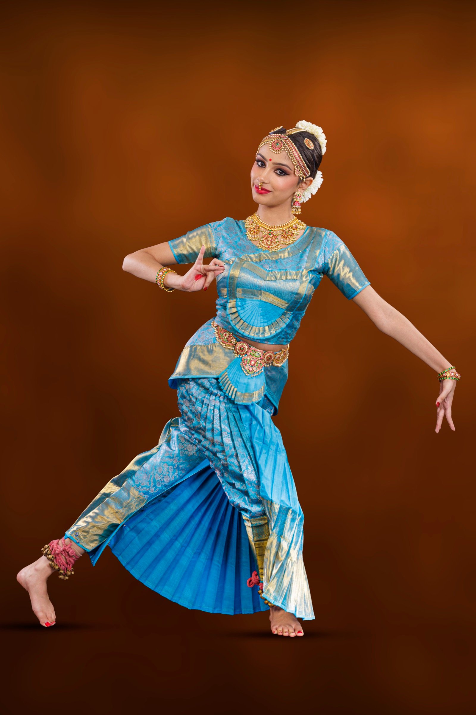 Ilesha in a wide lunge with arms spread open